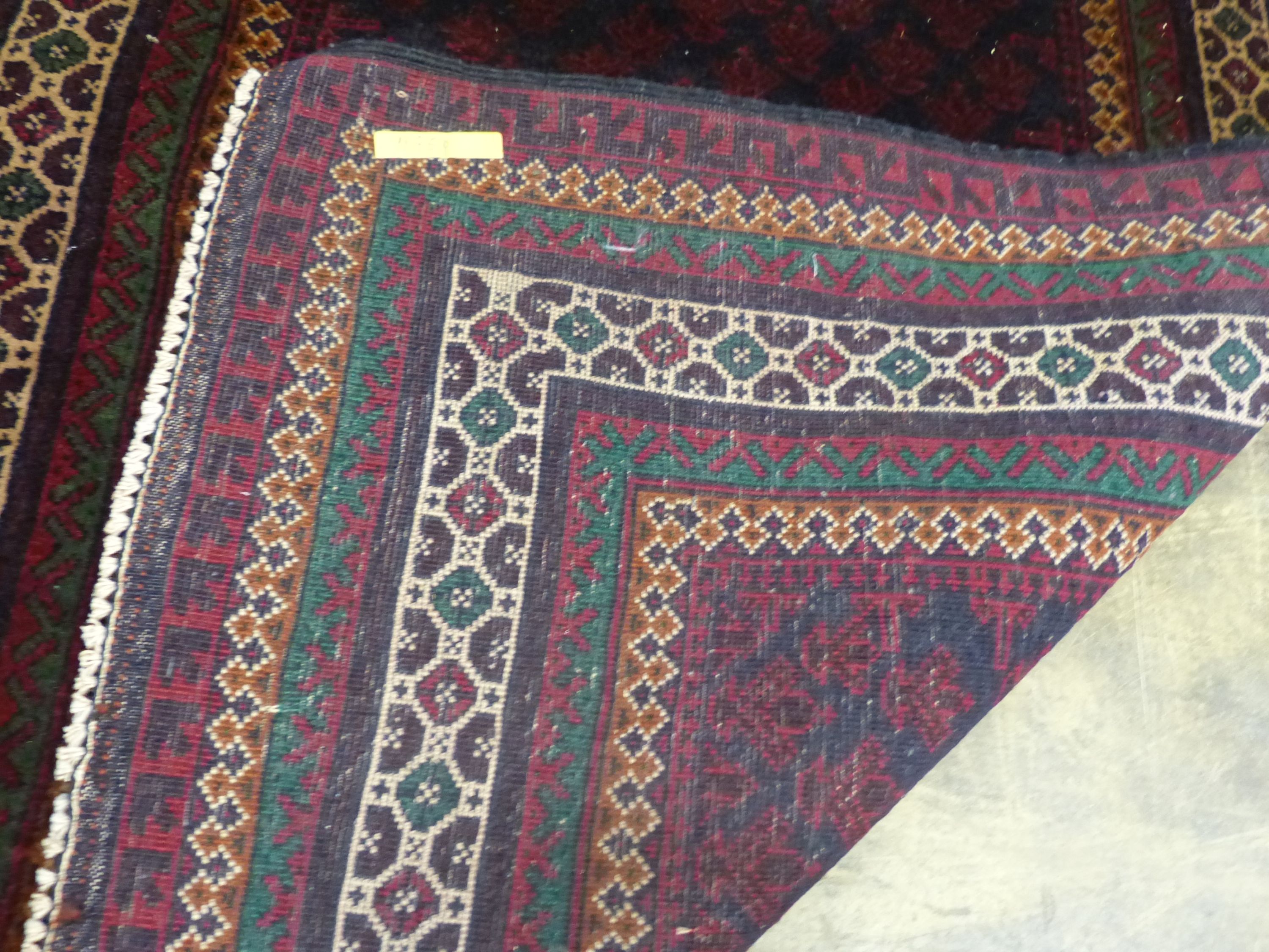 A Belouch red ground prayer rug, 146 x 90cm
